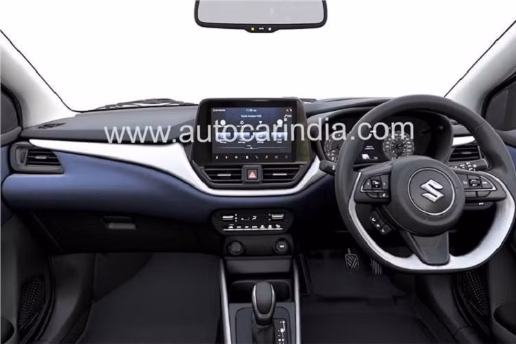 Tương tự ngoại thất, nội thất của Suzuki Baleno 2022 cũng được nâng cấp đáng kể với mặt táp-lô thiết kế 3 tầng hoàn toàn mới. Tầng trên cùng được sơn màu đen và trông khá giống với Suzuki S-Cross thế hệ mới. Tiếp đến là tầng giữa màu bạc làm điểm nhấn, bao quanh cửa gió điều hòa trung tâm và kéo dài sang hai bên cột A. Trong khi đó, tầng cuối cùng màu xanh đậm giống mặt cửa.