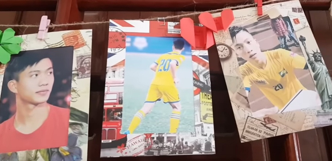 Bức hình của Phan Văn Đức được treo trên cửa sổ. Ảnh: Youtube.