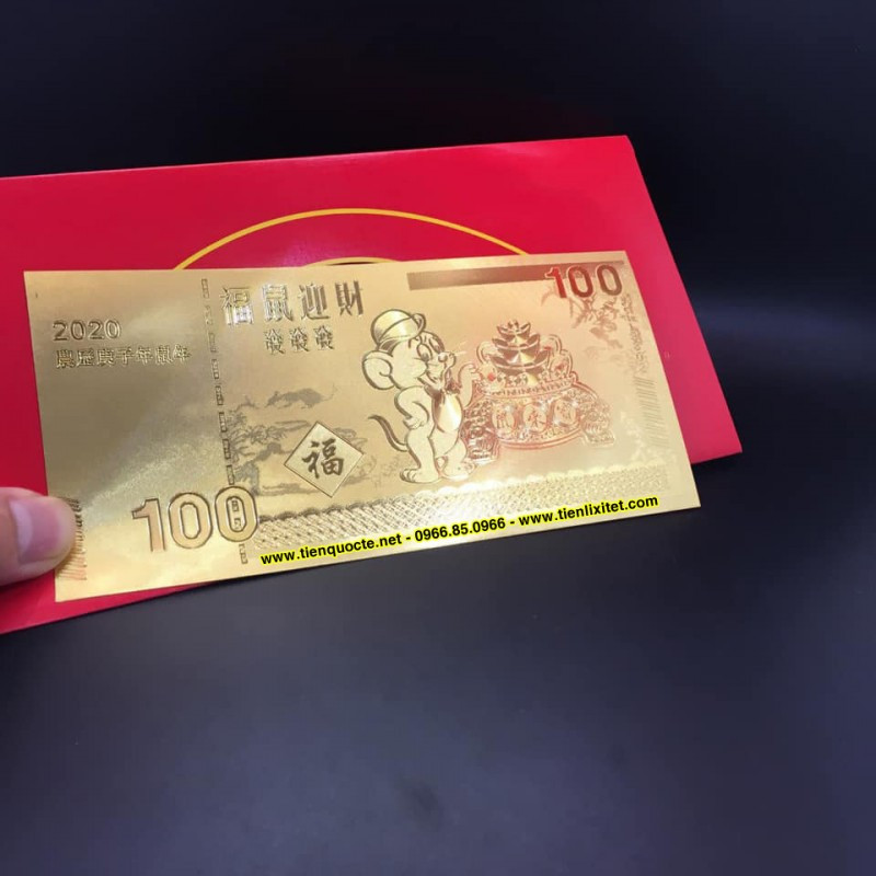 Tờ tiền này được làm trên chất liệu nhựa dẻo cao cấp mạ tĩnh điện một lớp hợp kim vàng mỏng sáng bóng, có thể làm quà tặng hoặc trang trí trên cây mai, đào ngày Tết.