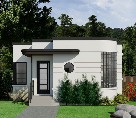 Điểm nhấn là mặt tiền bị bẻ cong. Tại đó thiết kế các ô cửa kính vuông nhỏ đưa ánh sáng vào trong nhà. Ảnh: Thoitrangkiwi.