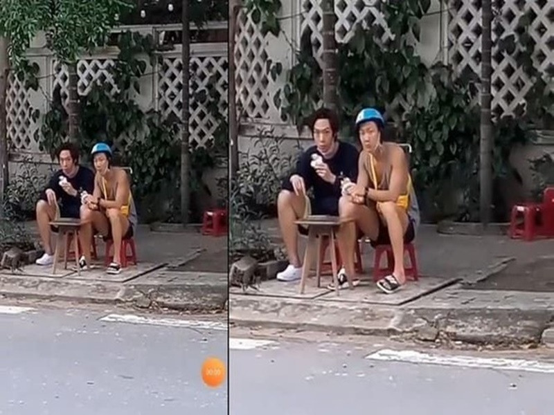 Hai ngôi sao Hàn Quốc Lee Seung Hoon và Baek Ji Woong ngồi ăn bánh mì bên lề đường ở Đà Nẵng năm 2019. Ảnh: Bestie.