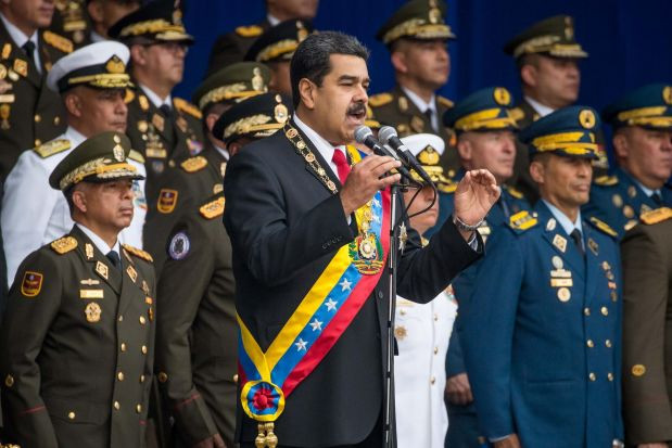 Vụ nổ xảy ra khi Tổng thống Nicolas Maduro đang thực hiện bài phát biểu lễ kỷ niệm 81 năm thành thành lập lực lượng Vệ binh Quốc gia. Nguồn ảnh: The Guardian