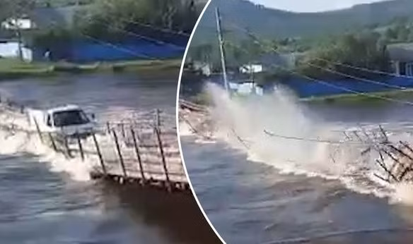 Video: Xe tai chim nghim giua song khi bang qua cay cau go