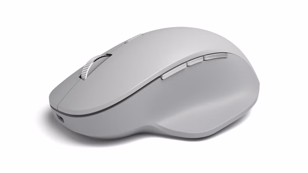 Microsoft Surface Precision Mouse. Bên cạnh Logitech hay Apple, chuột máy tính của Microsoft cũng được đánh giá cao với thiết kế đẹp, kết nối ổn định. Với giá 70 USD, Surface Precision Mouse có thiết kế đơn giản, cảm biến 3.600 DPI, pin tối đa 3 tháng, nút bấm tùy chỉnh và bánh xe cuộn từ tính. Tương tự phần mềm Flow cho chuột Logitech, sản phẩm của Microsoft cũng trang bị tính năng kết nối nhiều máy cùng lúc, cho phép chuyển đổi, chia sẻ file giữa các máy với thao tác kéo thả.