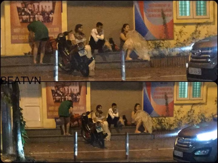 Mưa to, gió lớn, nhiều người dân ở Hà Nội lo ngại đi xe dễ bị ngã nên đã quyết định ngồi trú bão trên vỉa hè. Cảnh tượng mọi người chia sẻ với nhau từng mái hiên, từng bậc cửa tuy không quá đặc sắc nhưng vẫn chứa đựng trong đó nhiều sự đồng cảm, sẻ chia của mọi người. Ảnh trong bài: Otofun/Beat.vn.