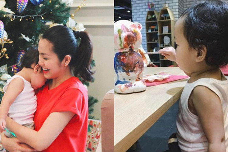 Hà Tăng từng chia sẻ hình ảnh con trai nép vào lòng mẹ và khoảnh khắc cậu quý tử thích thú tô tượng.