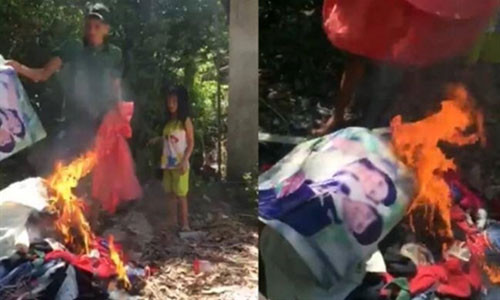 Anh B. đốt ảnh cưới và quần áo vợ khi cho rằng vợ bỏ đi theo người khác.