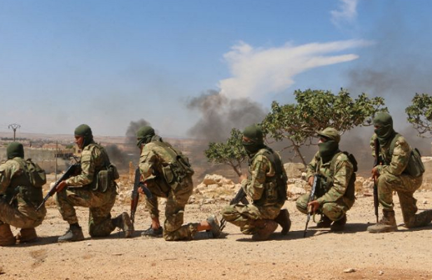 Sau khi gây tổn thất cho lực lượng chính phủ Damascus, các tay súng NLF mau chóng rút lui về căn cứ của bọn chúng. Ảnh: YN.