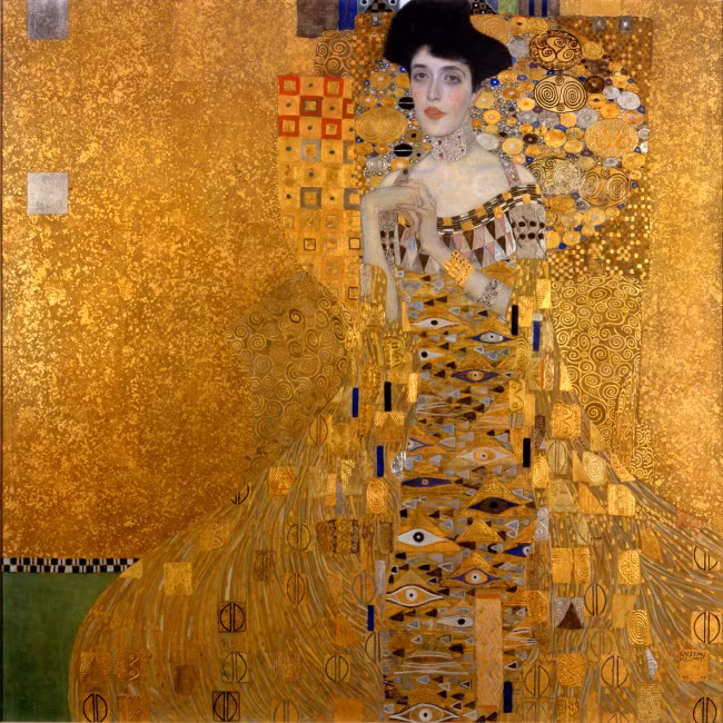 Một trong những tác phẩm nổi tiếng nhất của Gustav Klimt là bức tranh ông vẽ Adele Bloch-Bauer. Tuy nhiên, ông làm việc này là theo yêu cầu của chồng bà Adele - ông trùm công ty sản xuất đường Ferdinand Bloch-Bauer. Ferdinand sau khi phát hiện Adele ngoại tình với Klimt đã quyết định thuê danh họa này vẽ hàng trăm bức tranh vợ mình để Klimt mệt mỏi và căm ghét bà. Điều này dường như đã hiệu quả khi làm tình cảm của danh họa với bà Adele nguội lạnh dần.