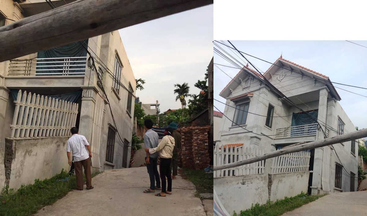 Ngôi nhà 2 tầng bị nghiêng do sụt đường.