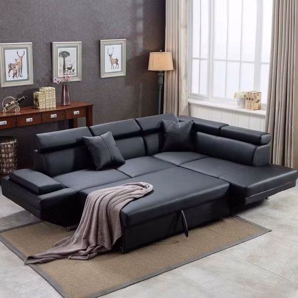 Ghế sofa da có tựa đầu và chân ghế có thể điều chỉnh, nhanh chóng trở thành một chiếc giường ngủ thoải mái mỗi khi có khách.