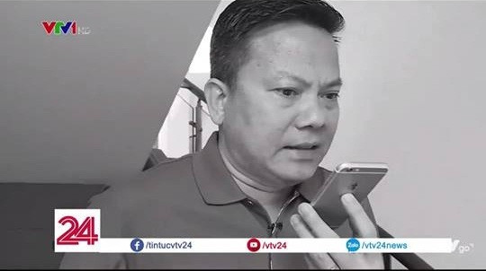 Ông Khoa gọi điện giúp giải cứu con thoát nạn khỏi đám cháy tại chung cư Carina. Ảnh VTV 24