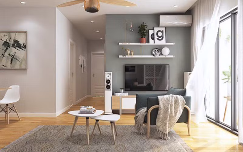 Theo đó, Đan Lê muốn đưa ánh sáng, thiên nhiên vào nơi ở của cả gia đình nhiều nhất có thể. 1 góc nhà được sơn màu xám để tạo điểm nhấn.