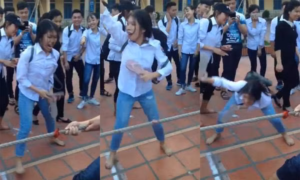 Dù không trực tiếp thi kéo co nhưng cô gái này lại gây chú ý bằng việc cổ vũ hết sức sung.