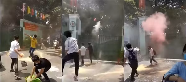 Việc liên tiếp dùng bột màu ném vào cổng trường của các nam sinh xuất hiện trong clip khiến một vùng phía ngoài cổng trường "ngập ngụa" trong khói bụi của những túi bột màu.
