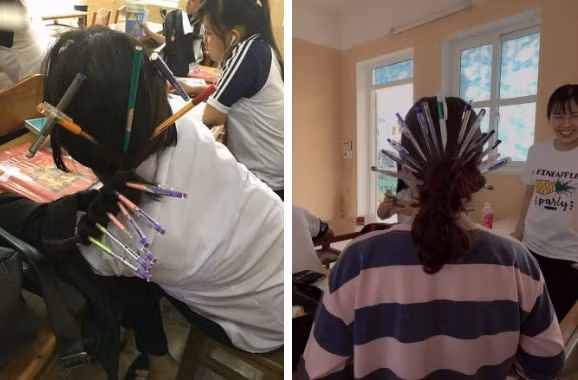 Các bạn trẻ đã cùng nhau sáng tạo ra những kiểu tóc trong hậu cung không thể chất hơn. Chẳng cần phải búi tóc hay tết sam, các bạn học sinh chỉ cần cắm bút bi là đã trở thành cung tần mỹ nữ ngay trong lớp học của mình.