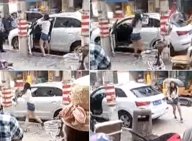 Chiếc xe tiền tỷ đã bị cô nàng đập nát tan không thương tiếc trước sự chứng kiến của vô vàn những người dân đi trên phố.