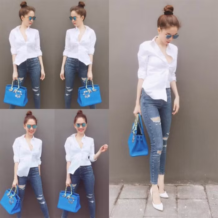 Ở set đồ khác, Ngọc Trinh tinh nghịch đóng nửa vạt áo sơ mi làm cho bộ đồ không quá cứng mà cũng không quá nổi loạn. Ảnh: Vietq.