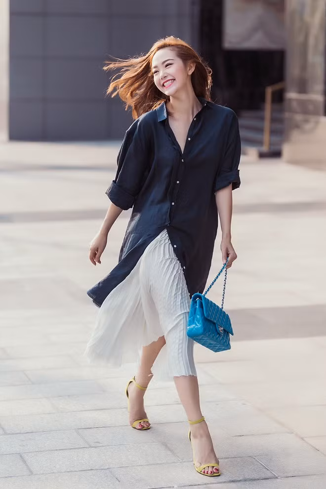 Nếu muốn chất hơn, hãy học Minh Hẳng cách mix như thế này. Một chiếc váy xòe và áo sơ mi suông dáng dài. Bạn sẽ trở thành một fashionista thật sự. Ảnh: Zingnews.