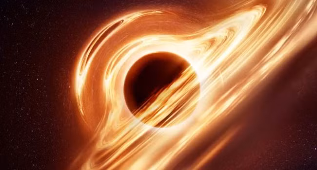 Ảnh hưởng lực hấp dẫn từ hố đen nung nóng lượng vật chất này khiến đĩa bồi tụ phát sáng rực rỡ.