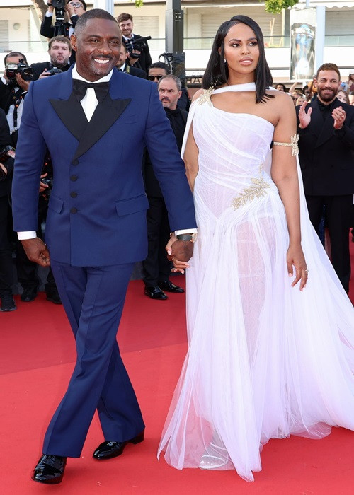 Idris Elba sánh đôi cùng bà xã kém 17 tuổi. Tài tử từng được People chọn là người đàn ông quyến rũ nhất thế giới. Ảnh: Harpersbazaar