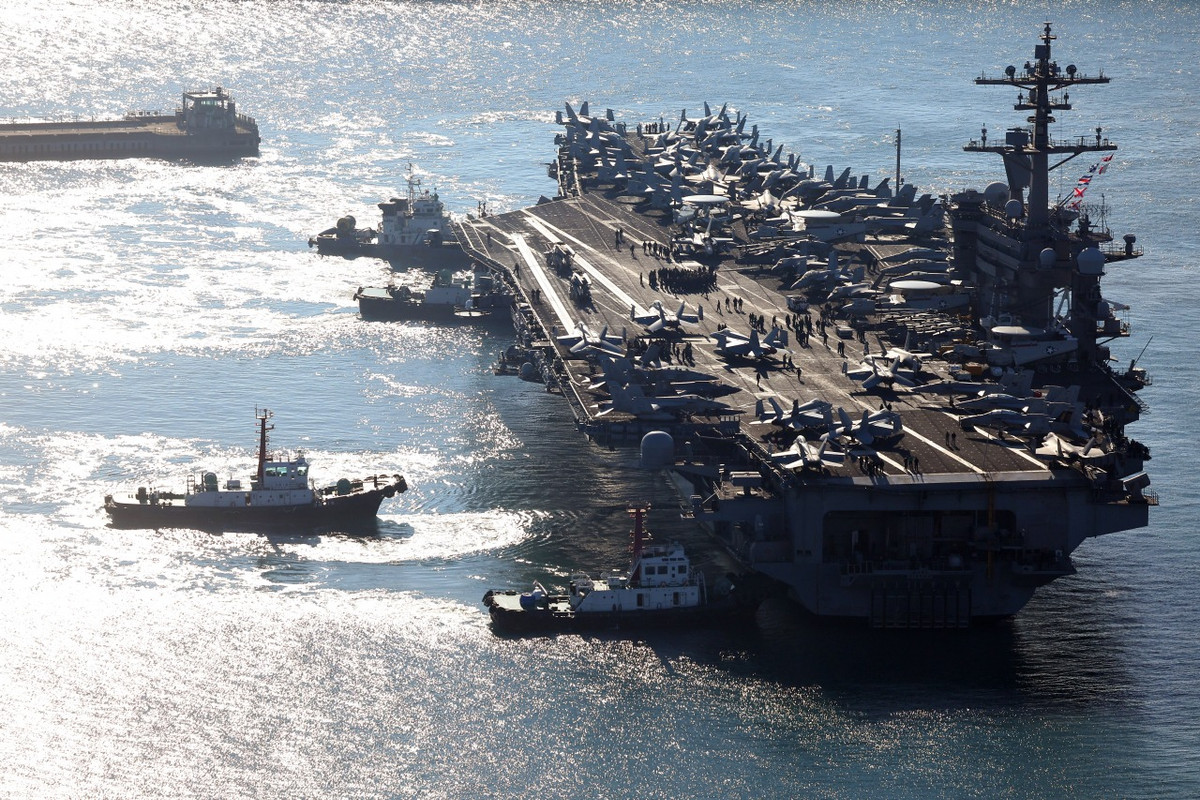 Con tàu được hạ thủy khi Vinson còn sống vào năm 1980, thực hiện chuyến đi đầu tiên vào năm 1983 và trải qua tiếp nhiên liệu và đại tu từ năm 2005 đến năm 2009.