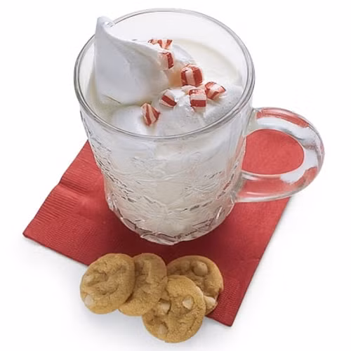 Dùng lớp bọt kem béo cho lên trên và trang trí bằng những viên kẹo hình trái tim để tăng phần lãng mạn cho ly sữa. Ảnh: quanngon