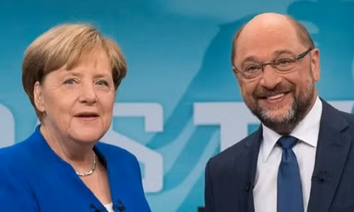 Thủ tướng Đức Angela Merkel và Chủ tịch đảng Dân chủ Xã hội Martin Schulz. Ảnh: EPA.