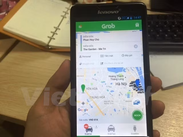 Ứng dụng phần mềm gọi xe của Grab. Ảnh: Việt Hùng/Vietnam+.