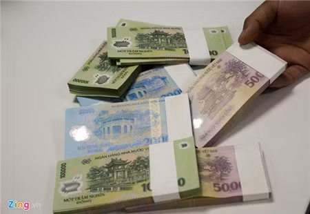 Nhiều lãnh đạo ngân hàng khẳng định thưởng Tết Nguyên đán 2018 chắc chắn sẽ tăng so với năm 2017. Ảnh minh họa: Quang Thắng.