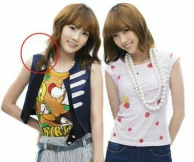 Bàn tay bí ẩn xuất hiện trên vai của Taeyeon.