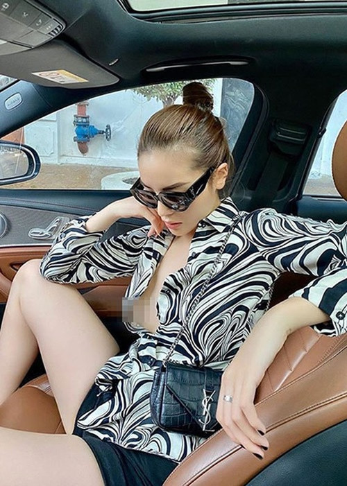 Kỳ Duyên khoe vòng một buông lơi với áo sơ mi, không nội y.