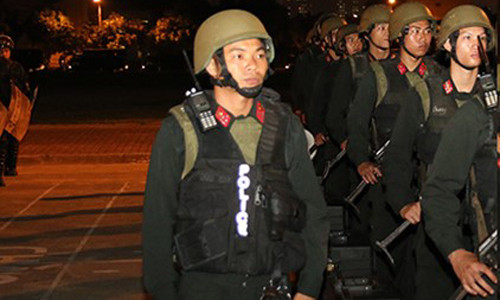 Thượng úy Đinh Đức Thắng, chỉ huy kíp trực 100 chiến sĩ tinh nhuệ, chuẩn bị kế hoạch bảo vệ Tổng thống Obama. Ảnh do công an cung cấp.