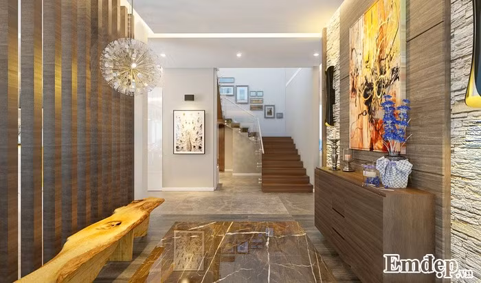 Vách ngăn giữa phòng khách và khu vực trang trí đồ lưu niệm cho gia chủ.