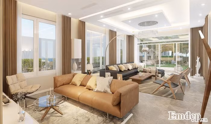 Phòng khách Phòng khách hiện đại của biệt thự xanh với cửa kính rộng tạo độ thoáng. Ở đây, gia chủ kê thoải mái 2 bộ bàn ghế để những dịp lễ, tết bạn bè, người thân có thể đến chơi.