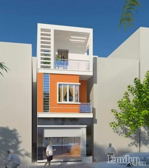 Mặt tiền ngôi nhà được KTS thiết kế trẻ trung, bắt mắt với mảng tường trung tâm màu cam làm điểm nhấn.