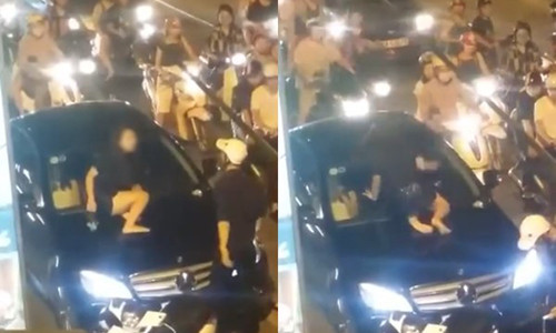 Cô gái nhảy lên nóc xe đánh ghen giữa phố. Ảnh cắt từ clip.