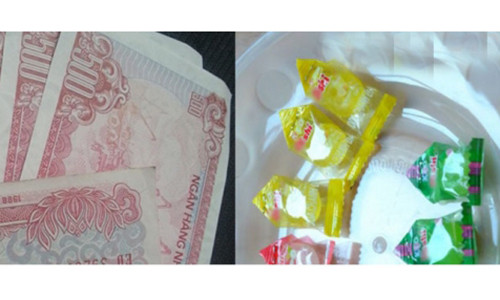 Khach hang cao tay day co thu ngan tra tien thua bang keo