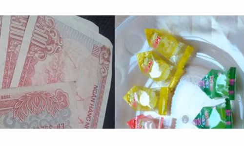 Khach hang cao tay day co thu ngan tra tien thua bang keo