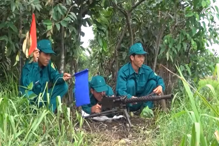 Trong ảnh là lực lượng Dân quân Tự vệ với súng máy M1919 Browning trong diễn tập khu vực phòng thủ 2018. Nguồn ảnh: THKG.