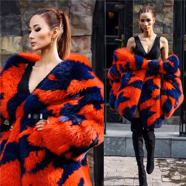 Đến tập đầu tiên của Gương mặt Thương hiệu, Hoàng Thùy đã gây ấn tượng mạnh khi diện váy 2 dây đen kết hợp áo lông thú đỏ sang trọng. Tuy nhiên, điểm trừ của cô là thời tiết quá nóng cộng với thân hình gầy guộc khiến cô như ngộp thở trong chiếc áo. Ảnh: Yannews.