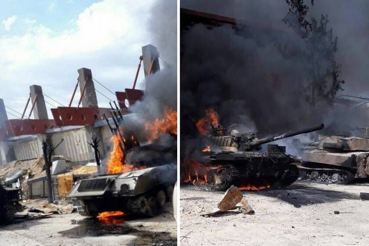 Ngoài các vũ khí bộ binh cầm tay được Jaysh Al-Islam giao nộp cho quân đội Syria thì hầu hết các phương tiện quân sự hạng nặng như xe tăng, pháo phòng không đều bị nhóm này đốt bỏ trước khi rút khỏi Douma. Ảnh: almasdarnews.