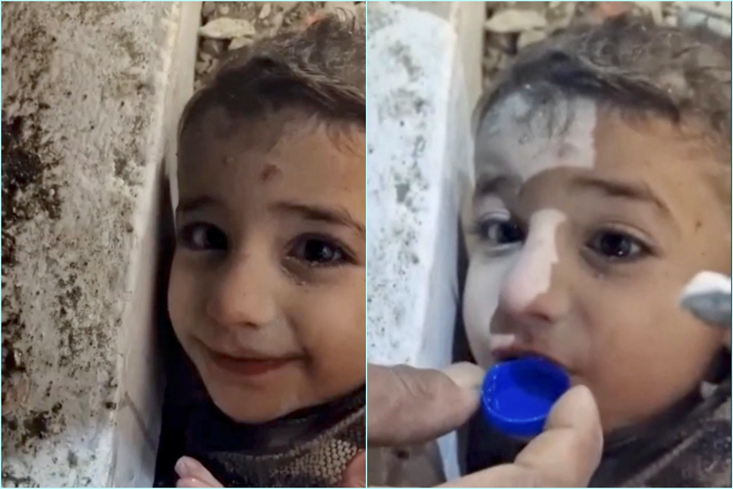 Một cậu bé được giải cứu khỏi đống đổ nát sau trận động đất ở Hatay, Thổ Nhĩ Kỳ, ngày 7/2. Ảnh: Reuters.