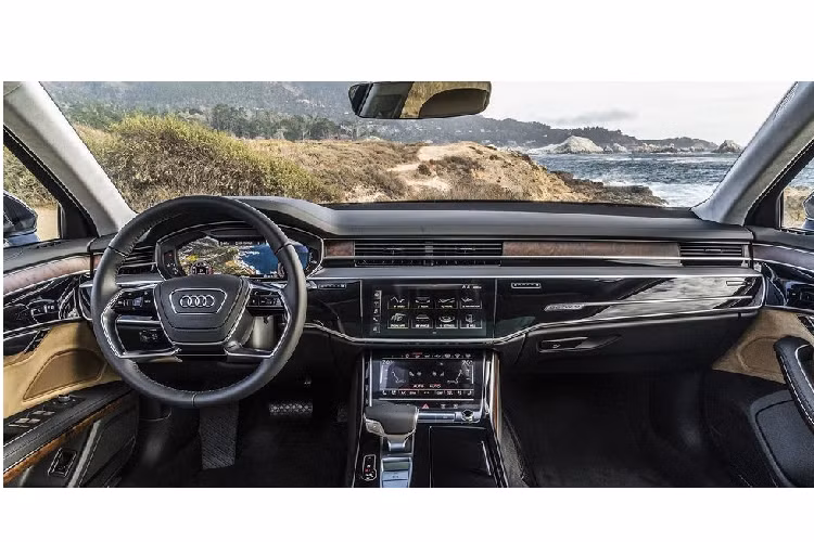 Audi A8L Khoang lái của Audi A8 mới là một nơi đáng để bỏ thời gian thưởng thức, nhưng điều làm người ta hứng thú nhất là các công nghệ. Bảng đồng hồ của xe là dạng kỹ thuật số hoàn toàn, và mặt táp lô có bao gồm 2 màn hình cảm ứng lớn để điều khiển tất cả mọi thứ. Phiên bản xe cao cấp thậm chí còn có một chiếc máy tính bảng có thể tháo ra ở ghế sau.