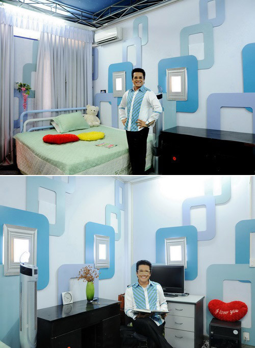 Phòng ngủ tầng hai cũng mang sắc xanh chủ đạo với những hoa văn vuông tròn độc đáo trên mảng tường. Ảnh: Khám Phá.