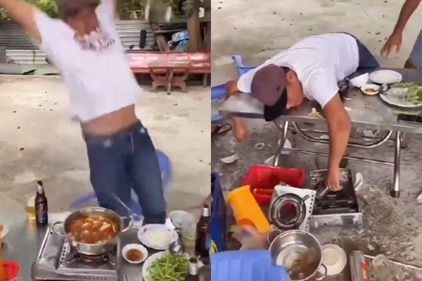 Dù được can ngăn nhưng chàng trai vẫn quyết chụp bằng được và còn đứng hẳn lên ghế. Xui rủi làm sao anh lại trượt chân ngã úp mặt xuống bàn. Dù không bị thương do khoảng cách không cao nhưng cả bàn thức ăn lẫn nồi lẩu đều “đáp đất”. Ảnh: Chụp màn hình TikTok K.T.T