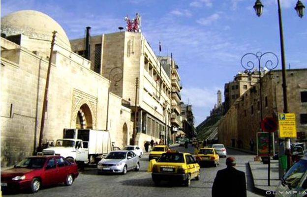 Đường phố Aleppo tấp nập xe cộ trước đây. Ảnh: Olympia.