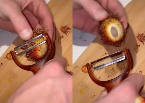 Thay vì khứa vỏ để ăn thì cô gái này lại chọn cách khó hơn là gọt từng chút vỏ của quả chôm chôm.