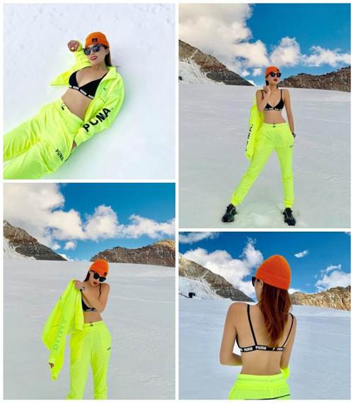 Không kém đàn chị, Kỳ Duyên trong chuyến du lịch nước ngoài cũng tranh thủ khoe tấm lưng trần giữa tuyết trắng.