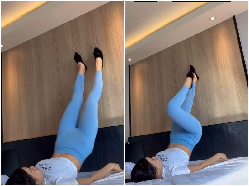 Giường ngủ cũng hóa thành nơi tập luyện của cô. Với động tác nằm và co duỗi chân đạp tường, Yến Xuân đã có ngay bài tập làm săn chắc cơ đùi sau và giảm mỡ bụng hiệu quả.